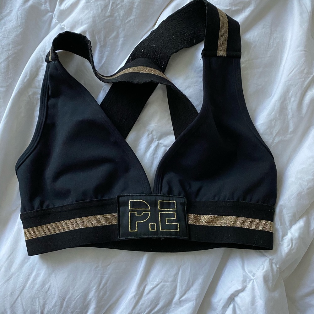 PE Nation black and gold sports bra
